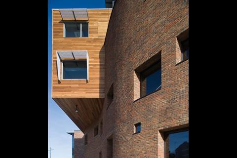 At its other end, the same boxy, oblong wing bursts through a curvy brick wing.